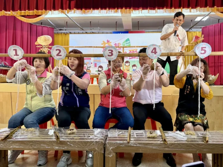 世壯運鏈球金牌得主機板橋包粽 挑戰包粽王快手益起送愛心！